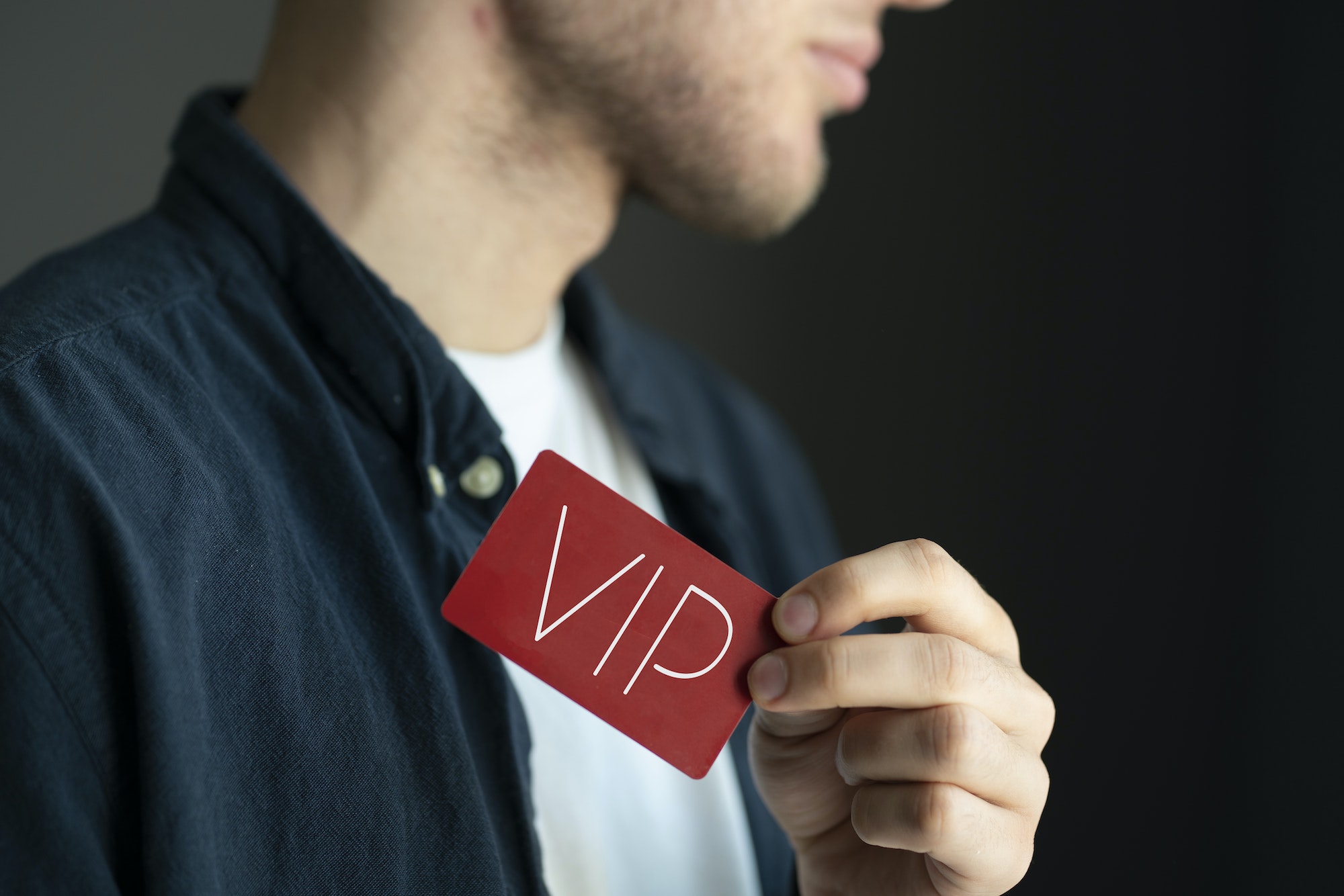 a person showing VIP card pass, exclusive access membership